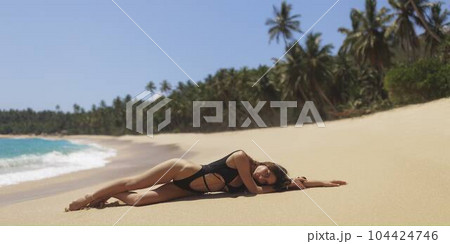 Beach Bikini Model With Perfect Slim Body in Black Swimsuit for Wellness Spa Luxury. Beach Bikini Model With Perfect Slim Body in Black Swimsuit for Wellness Spa Luxury. 104424746