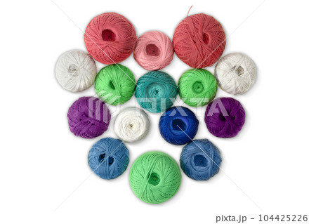 Multi-colored wool balls, yarn in shape of heart on white isolated background. Concept of knitting, sewing, needlework, hobby, Valentine day Multi-colored wool balls, yarn in shape of heart on white isolated background. Concept of knitting, sewing, needlework, hobby, Valentine day 104425226