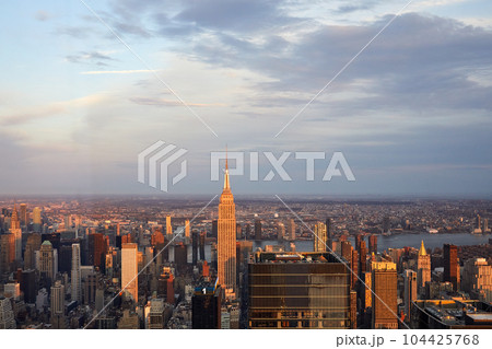 USA, New York, New York City, Aerial view of Manhattan skyscrapers at sunset USA, New York, New York City, Aerial view of Manhattan skyscrapers at sunset 104425768