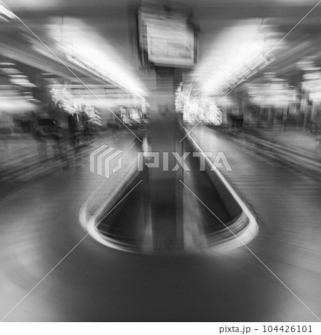 Blurred image of baggage claim area on airport Blurred image of baggage claim area on airport 104426101