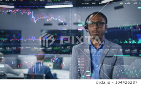 Investment specialist analyzes real-time stocks in office. VFX animation. Investment specialist analyzes real-time stocks in office. VFX animation. 104426287