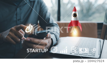 Watch your startup soar with this white rocket icon launching from a laptop, representing innovation, progress, and financial success. Network connection on modern virtual interface. Watch your startup soar with this white rocket icon launching from a laptop, representing innovation, progress, and financial success. Network connection on modern virtual interface. 104427024