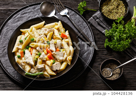 Creamy Chicken and Penne Pasta Casserole in bowl Creamy Chicken and Penne Pasta Casserole in bowl 104428136