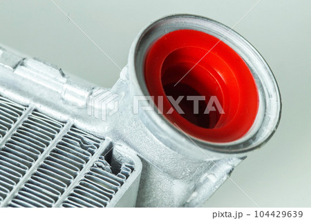 New car radiator car stove on a white background, close-up New car radiator car stove on a white background, close-up 104429639