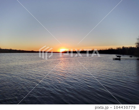 Spring sunset over the wide banks of the Dnieper River. Ukraine Spring sunset over the wide banks of the Dnieper River. Ukraine 104430779