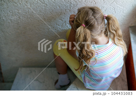 Lonely Upset Little Preschool Girl at Home. Sad Child Alone. Emotional Stress of Children, School, and Family Problems. Lonely Upset Little Preschool Girl at Home. Sad Child Alone. Emotional Stress of Children, School, and Family Problems. 104431083