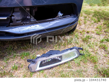 Removed fog lamp from a car to replace a burnt out light bulb. Close-up Removed fog lamp from a car to replace a burnt out light bulb. Close-up 104431740