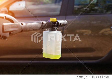 Nozzle foam generator for a sink of a high pressure. car chemicals, shampoo concentrate. Car care. copy space for text 104431756