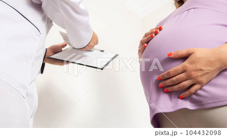 The doctor issues a referral to a pregnant girl for blood tests and a cytological examination of a scraping from the cervical canal and cervix. Examination of pregnant women. The doctor issues a referral to a pregnant girl for blood tests and a cytological examination of a scraping from the cervical canal and cervix. Examination of pregnant women. 104432098