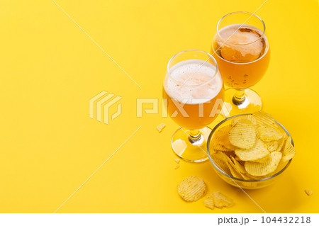 A tempting snack of beer and chips 104432218