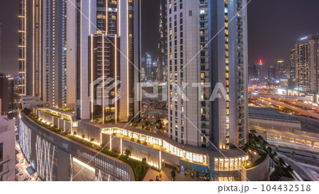Tallest skyscrapers in downtown dubai located on bouleward street near shopping mall aerial day to night timelapse. Tallest skyscrapers in downtown dubai located on bouleward street near shopping mall aerial day to night timelapse. 104432518