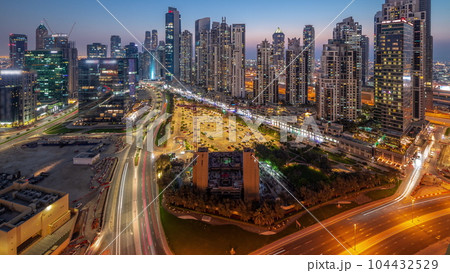 Bay Avenue with modern towers residential development in Business Bay aerial panoramic day to night timelapse, Dubai Bay Avenue with modern towers residential development in Business Bay aerial panoramic day to night timelapse, Dubai 104432529