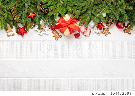 Xmas fir tree branch, Christmas gift box and space Xmas fir tree branch, Christmas gift box and space 104432593