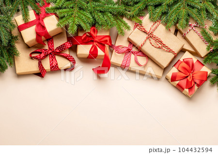 Xmas fir tree branch, Christmas gift boxes and space 104432594