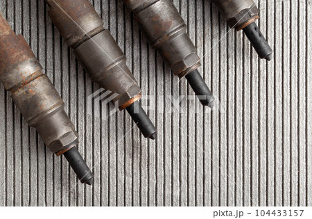 Injectors with diesel engine fuel supply system. Fuel spray. Automotive Part. Copy space for text Injectors with diesel engine fuel supply system. Fuel spray. Automotive Part. Copy space for text 104433157