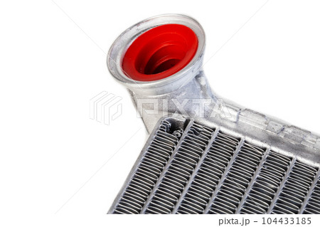 Part of a car heater radiator on a white background, close-up. Automotive spare part. Close-up Part of a car heater radiator on a white background, close-up. Automotive spare part. Close-up 104433185