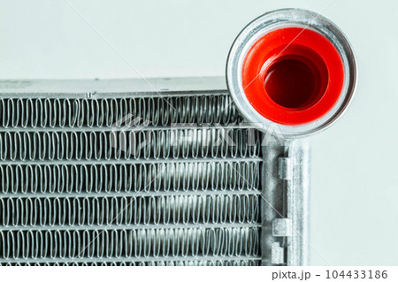 New car radiator car stove on a white background, close-up 104433186