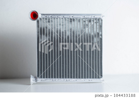 Aluminum radiator of a car stove on a white background, close-up, isolated Aluminum radiator of a car stove on a white background, close-up, isolated 104433188