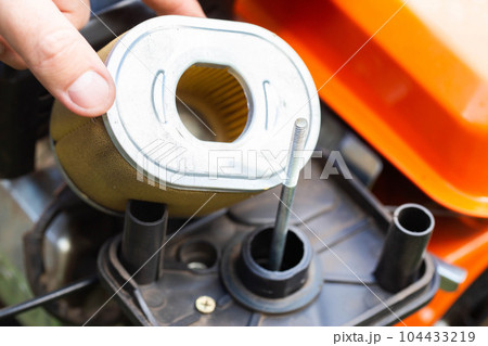 replacement of the air filter in the motoblock, service maintenance of agricultural machinery.Industry, walk-behind tractor replacement of the air filter in the motoblock, service maintenance of agricultural machinery.Industry, walk-behind tractor 104433219