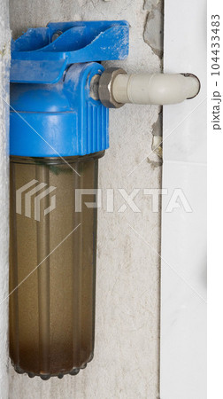 Coarse water filter in the bathroom, purification water. Close-up Coarse water filter in the bathroom, purification water. Close-up 104433483
