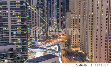 Overview to JBR and Dubai Marina skyline with modern high rise skyscrapers waterfront living apartments aerial day to night timelapse Overview to JBR and Dubai Marina skyline with modern high rise skyscrapers waterfront living apartments aerial day to night timelapse 104434007
