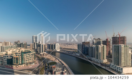 Skyscrapers at the Business Bay aerial all day timelapse in Dubai, United Arab Emirates 104434259
