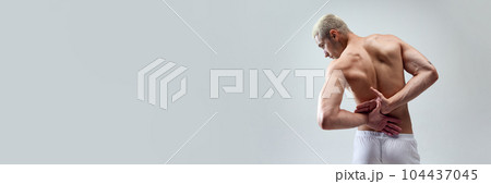 Cropped image of beautiful, strong, muscular, relief male's back against grey studio background 104437045