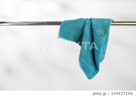 The dirty cloth with wrinkles hanging on the clothesline. The dirty cloth with wrinkles hanging on the clothesline. 104437108