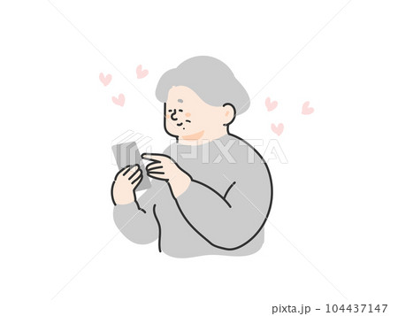 スマートフォンを操作する笑顔なシニア女性 スマートフォンを操作する笑顔なシニア女性 104437147