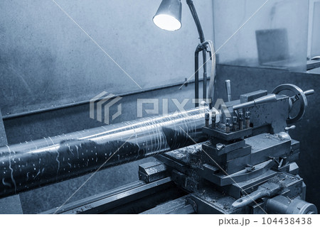 The lathe machine finish cut large size metal shaft parts with liquid coolant method. The lathe machine finish cut large size metal shaft parts with liquid coolant method. 104438438
