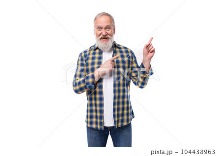 well-groomed 50s mid-aged gray-haired retired man with mustache and beard shows his hand to the side 104438963