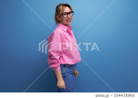 young smart successful caucasian blond leader woman with ponytail with glasses wearing pink blouse young smart successful caucasian blond leader woman with ponytail with glasses wearing pink blouse 104438968
