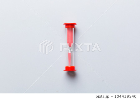 hourglass on the table, sand clock as time passing concept for business deadline, copy space hourglass on the table, sand clock as time passing concept for business deadline, copy space 104439540