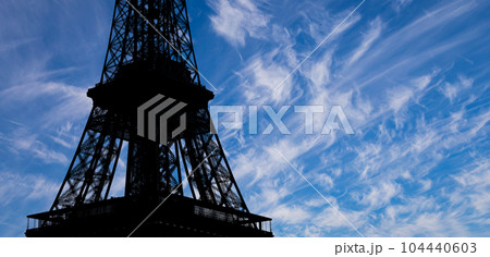 Eiffel Tower against the background of a beautiful sky with clouds. Paris, France Eiffel Tower against the background of a beautiful sky with clouds. Paris, France 104440603