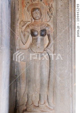 An ancient bas-relief image of a woman in a medieval Khmer temple. An ancient bas-relief image of a woman in a medieval Khmer temple. 104441249