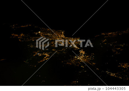 Nighttime aerial view of illuminated city Saint Raphael and coastal France from the sky 104443305