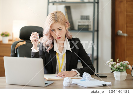 Close up on laptop in office, Asian happy beautiful businesswoman in formal suit work in workplace. Attractive female employee office worker smile. Close up on laptop in office, Asian happy beautiful businesswoman in formal suit work in workplace. Attractive female employee office worker smile. 104446481