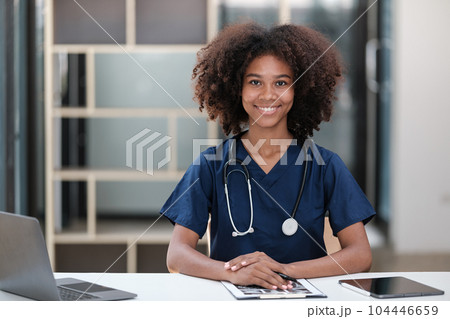 Portrait of female African American doctor with Stethoscope in her office at clinic. 104446659