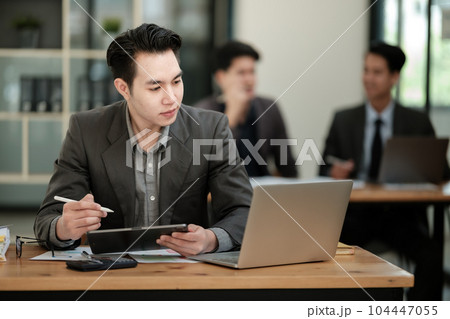 Handsome cheerful asian man executive business man at the workspace office  104447055
