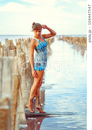 a girl in a swimsuit on a salt lake a girl in a swimsuit on a salt lake 104447547