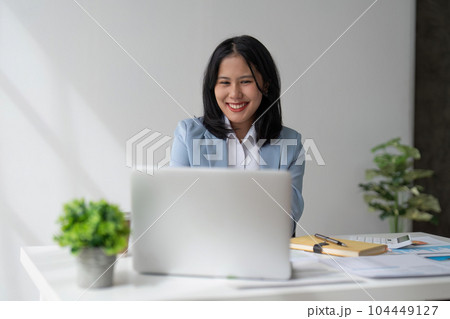 businesswoman work with laptop, writing notes on colorful sticky papers in office 104449127