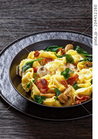 hot tortellini with mushrooms, spinach and bacon hot tortellini with mushrooms, spinach and bacon 104452160