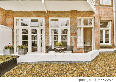 a brick house with white trim around the front door and windows that look like they'remeded from outside a brick house with white trim around the front door and windows that look like they'remeded from outside 104452257
