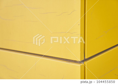 The exterior wall of the modern building is covered with yellow film. The futuristic building is designed using frame panels. With space to copy. High quality photo 104455850