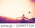 Freedom feel good and travel adventure concept. Copy space of silhouette man rising hands on sunset sky double exposure colorful bokeh and bird fly background. Vintage tone filter effect color style. 104457326