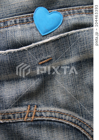 Blue heart on jeans. Birthday background. 104463393