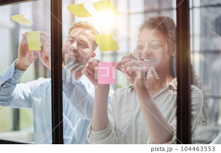Group of business people behind glass wall at office 104463553