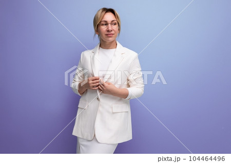 pretty young blond employer woman in white elegant jacket and skirt 104464496