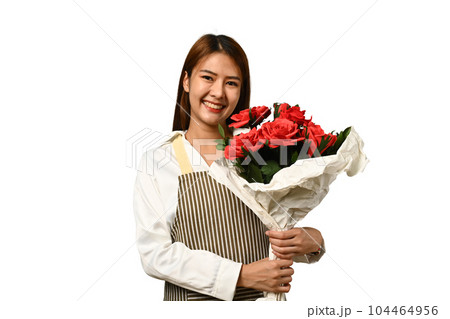 Portrait of attractive woman florist holding beautiful bouquet of red roses isolated on white background Portrait of attractive woman florist holding beautiful bouquet of red roses isolated on white background 104464956