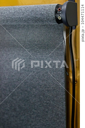 Technical photo of roller blind with motor. Close-up, selective focus. 104471114